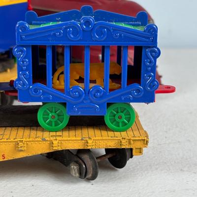 LOT 735: Red Locomotive & Tinder Car, American Flyer Circus Flat Cars with Cages & Truck/Tractors