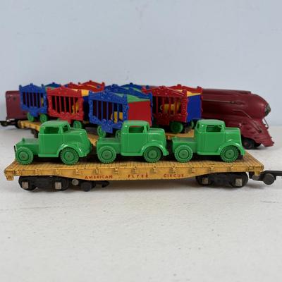 LOT 735: Red Locomotive & Tinder Car, American Flyer Circus Flat Cars with Cages & Truck/Tractors