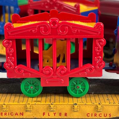 LOT 735: Red Locomotive & Tinder Car, American Flyer Circus Flat Cars with Cages & Truck/Tractors