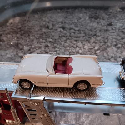 PLASTIC CAR HAULER WITH 4 DIE-CAST CORVETTE MODEL CARS
