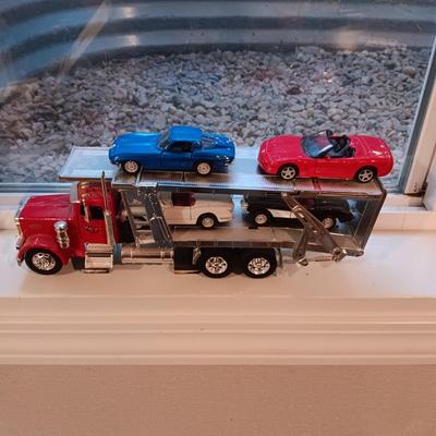 PLASTIC CAR HAULER WITH 4 DIE-CAST CORVETTE MODEL CARS