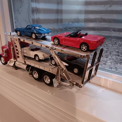 PLASTIC CAR HAULER WITH 4 DIE-CAST CORVETTE MODEL CARS
