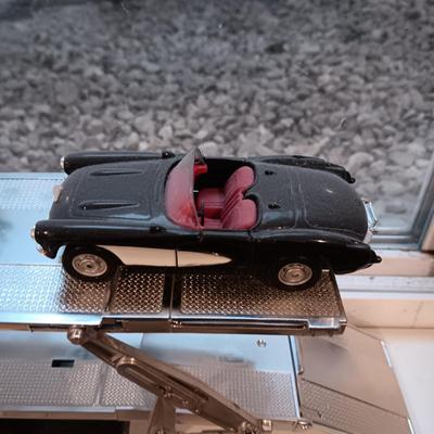 PLASTIC CAR HAULER WITH 4 DIE-CAST CORVETTE MODEL CARS