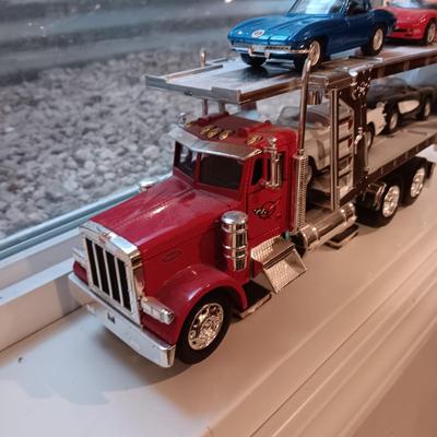 PLASTIC CAR HAULER WITH 4 DIE-CAST CORVETTE MODEL CARS