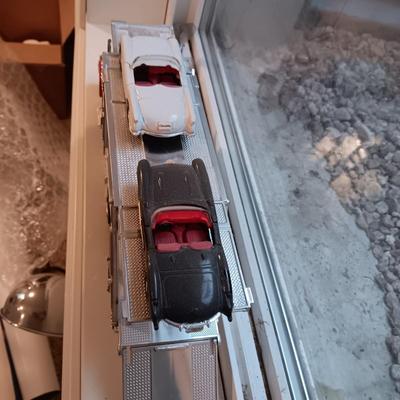 PLASTIC CAR HAULER WITH 4 DIE-CAST CORVETTE MODEL CARS