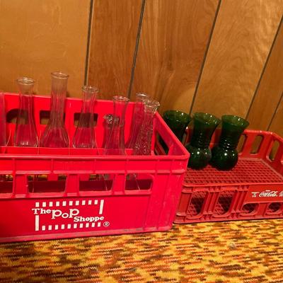 Pop Shoppe and Coke crates with clear and green glass vases