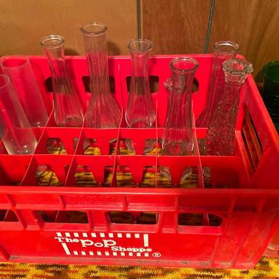 Pop Shoppe and Coke crates with clear and green glass vases