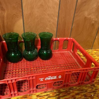 Pop Shoppe and Coke crates with clear and green glass vases