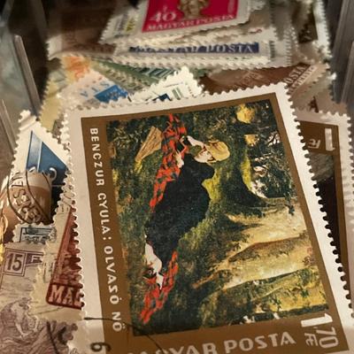Metal organizer with stamps from around the world