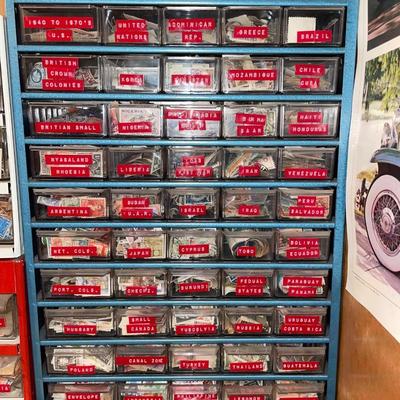 Metal organizer with stamps from around the world