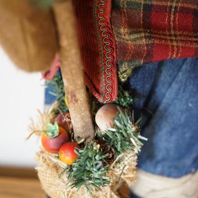 Sale Photo Thumbnail #146: sweet outdoor style crafted Santa. dressed in jeans and flannel . 
He has a cotton beard. about 14" in height. 
all is very well done. holds a feather style tree with faux fruit at the base