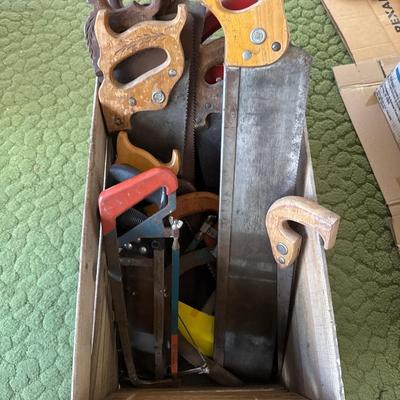 Wooden crate full of hand saw
