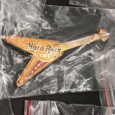 A VARIETY OF HARD ROCK CAFE PINS FROM VARIOUS PLACES