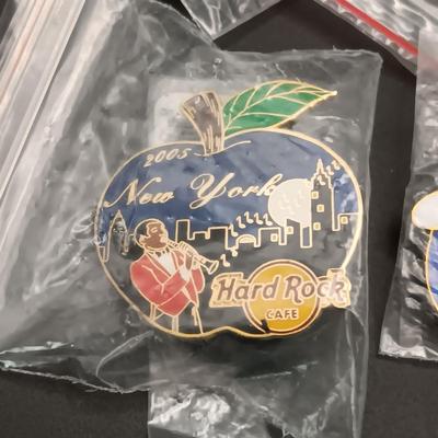 A VARIETY OF HARD ROCK CAFE PINS FROM VARIOUS PLACES