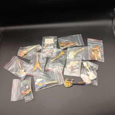 A VARIETY OF HARD ROCK CAFE PINS FROM VARIOUS PLACES