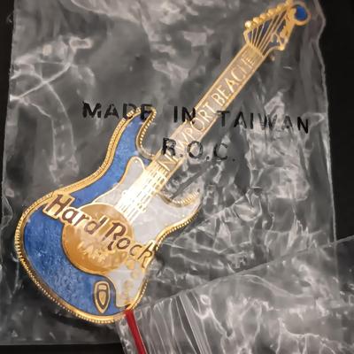 A VARIETY OF HARD ROCK CAFE PINS FROM VARIOUS PLACES