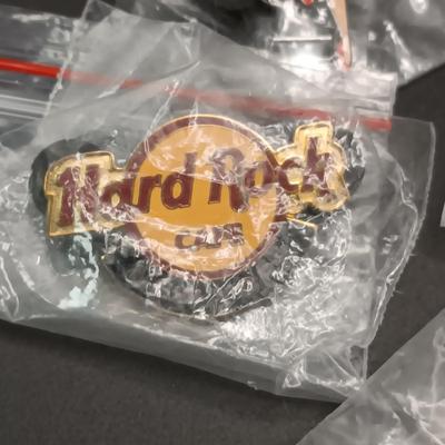 HARD ROCK CAFE WATCH AND PINS PLUS SEVERAL OTHER PINS