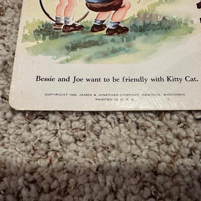 CHILDREN'S VINTAGE BOOKS AND AN ANIMATED PLUSH DOG