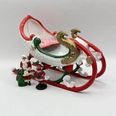 LOT 190L: Vintage Cast Iron Painted Sled & Miniature Metal Santas