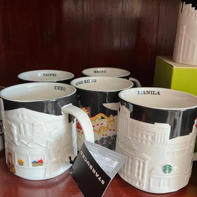 A Collection of 16 Starbucks City Mugs