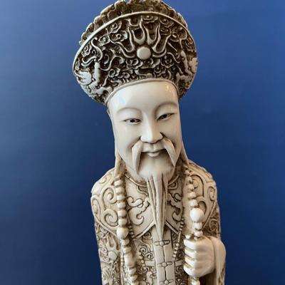 A Pair of Carved Chinese Figures