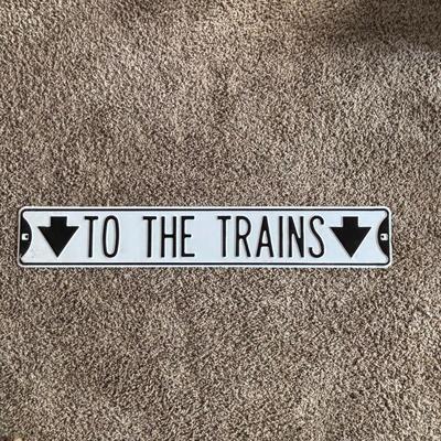 LOT 749: Metal "To The Train" Street Sign