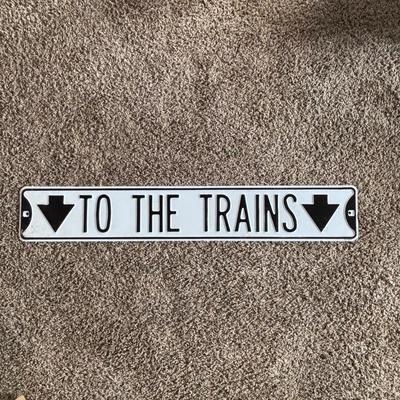 LOT 749: Metal "To The Train" Street Sign