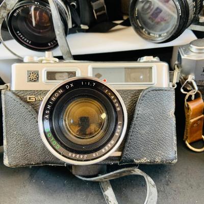 LOT 518: Large Assortment of 35mm Cameras, Lenses and More