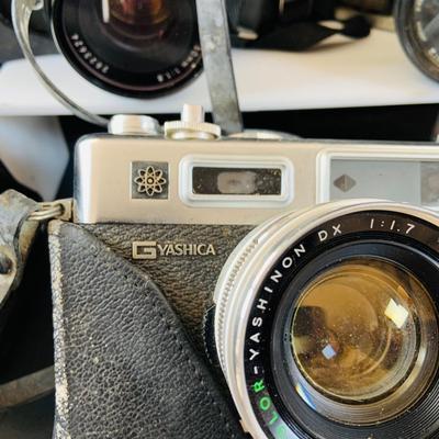 LOT 518: Large Assortment of 35mm Cameras, Lenses and More
