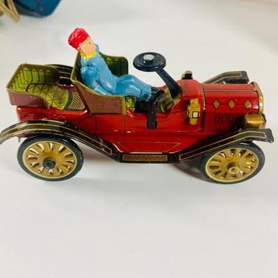 LOT 521:Vintage Collection Tin Toy Cars, Model T Plastic Salt and Pepper Shake Set, Pencil Shapener and Paperweight