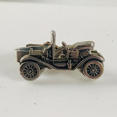 LOT 521:Vintage Collection Tin Toy Cars, Model T Plastic Salt and Pepper Shake Set, Pencil Shapener and Paperweight