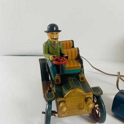 LOT 521:Vintage Collection Tin Toy Cars, Model T Plastic Salt and Pepper Shake Set, Pencil Shapener and Paperweight