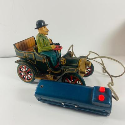 LOT 521:Vintage Collection Tin Toy Cars, Model T Plastic Salt and Pepper Shake Set, Pencil Shapener and Paperweight