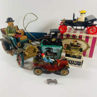 LOT 521:Vintage Collection Tin Toy Cars, Model T Plastic Salt and Pepper Shake Set, Pencil Shapener and Paperweight