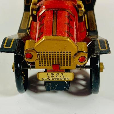 LOT 521:Vintage Collection Tin Toy Cars, Model T Plastic Salt and Pepper Shake Set, Pencil Shapener and Paperweight