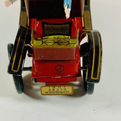 LOT 521:Vintage Collection Tin Toy Cars, Model T Plastic Salt and Pepper Shake Set, Pencil Shapener and Paperweight