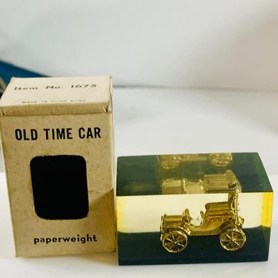 LOT 521:Vintage Collection Tin Toy Cars, Model T Plastic Salt and Pepper Shake Set, Pencil Shapener and Paperweight