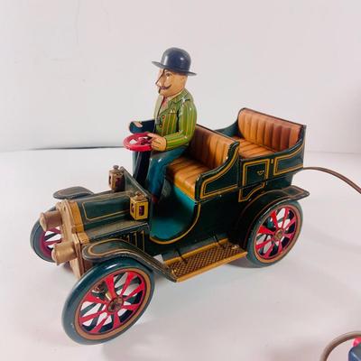 LOT 521:Vintage Collection Tin Toy Cars, Model T Plastic Salt and Pepper Shake Set, Pencil Shapener and Paperweight