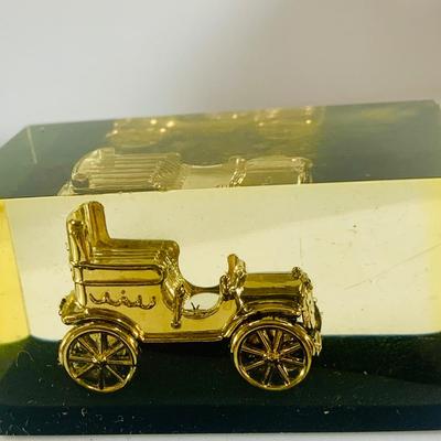 LOT 521:Vintage Collection Tin Toy Cars, Model T Plastic Salt and Pepper Shake Set, Pencil Shapener and Paperweight