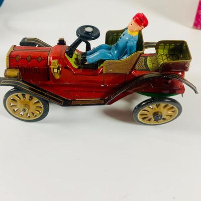 LOT 521:Vintage Collection Tin Toy Cars, Model T Plastic Salt and Pepper Shake Set, Pencil Shapener and Paperweight