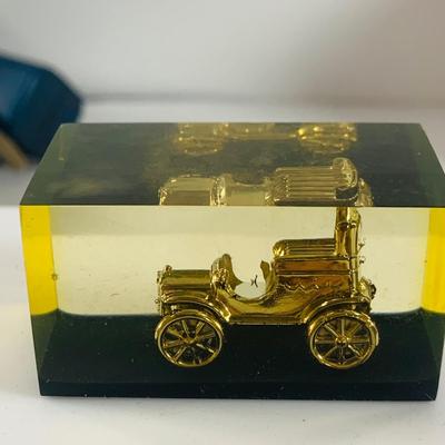 LOT 521:Vintage Collection Tin Toy Cars, Model T Plastic Salt and Pepper Shake Set, Pencil Shapener and Paperweight