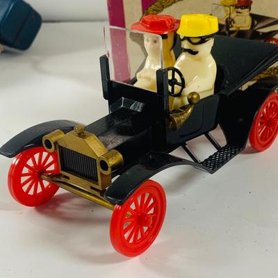 LOT 521:Vintage Collection Tin Toy Cars, Model T Plastic Salt and Pepper Shake Set, Pencil Shapener and Paperweight