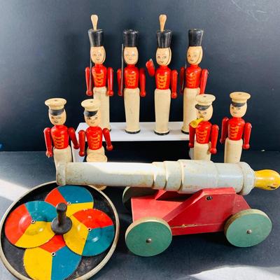 LOT 527: Collection of Vintage Toy Wood Soldiers and Wood Toy Canon and Metal Top