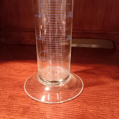 NEEDLEPOINT PHARMACY PICTURE, TALL GLASS BEEKER AND BRASS PESTLE & MORTAR