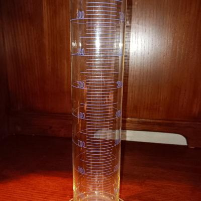 NEEDLEPOINT PHARMACY PICTURE, TALL GLASS BEEKER AND BRASS PESTLE & MORTAR