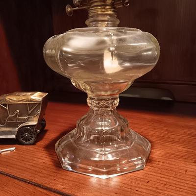 TALL GLASS OIL LAMP AND A METAL CAR BANK WITH THE KEY