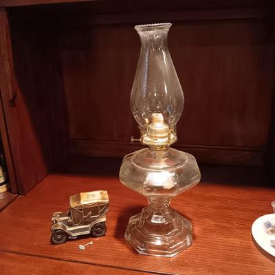 TALL GLASS OIL LAMP AND A METAL CAR BANK WITH THE KEY