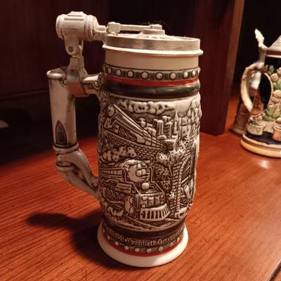 A VARIETY OF STEINS AND BEER MUGS