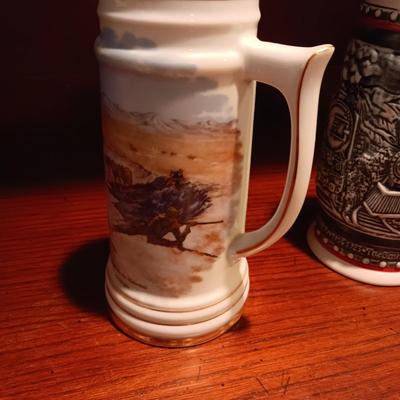 A VARIETY OF STEINS AND BEER MUGS