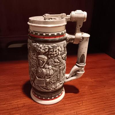 A VARIETY OF STEINS AND BEER MUGS